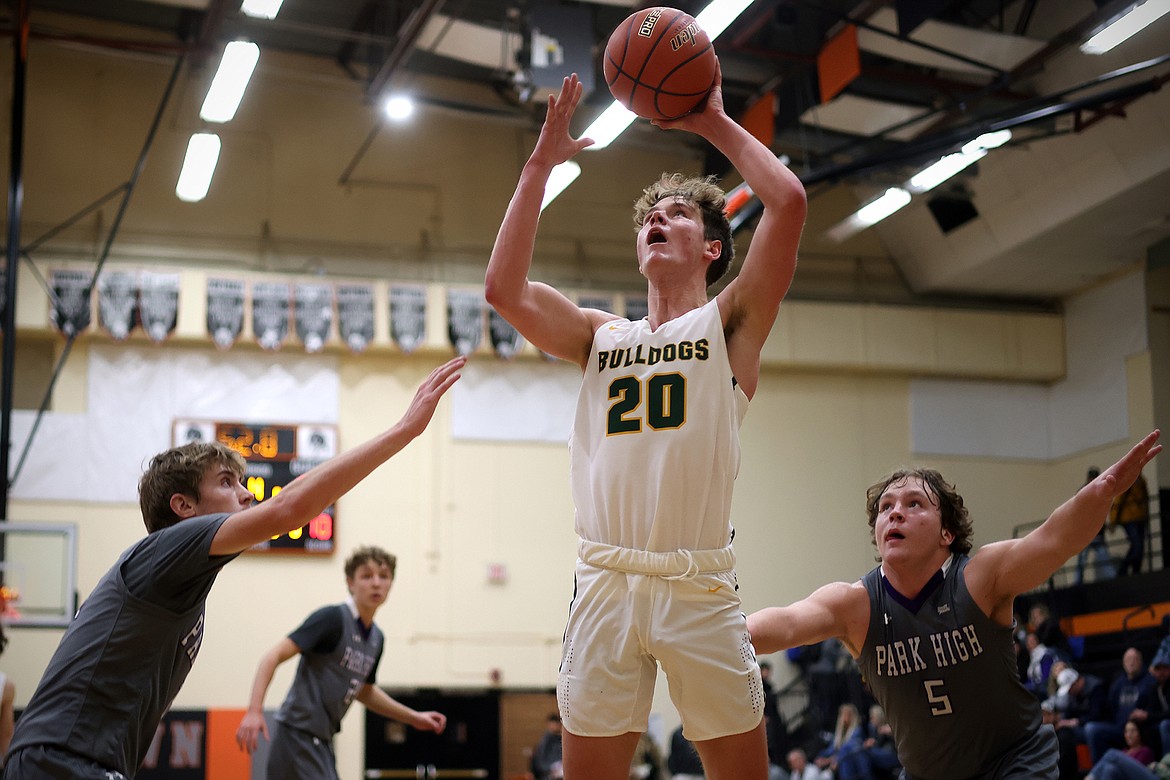 Bulldog Jack Sears takes a shot over Park defenders at the Frenchtown Tip-Off Tournament Friday, Dec. 9. (Jeremy Weber/Daily Inter Lake)