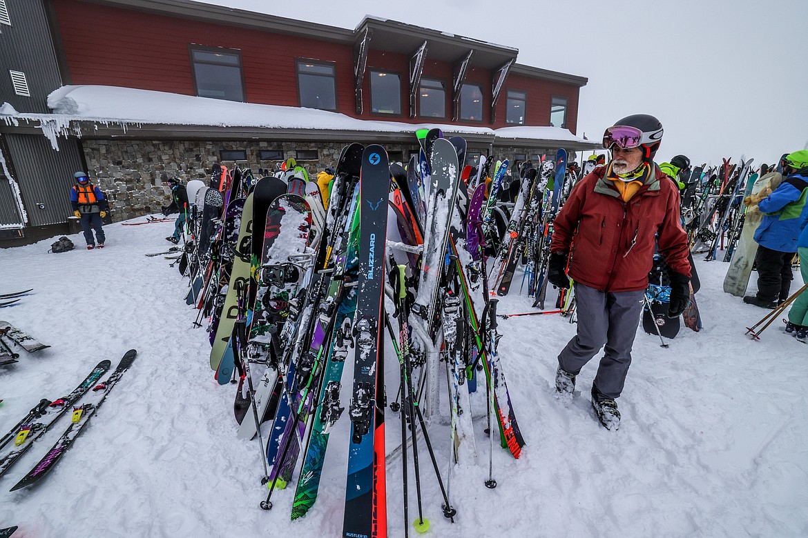 In a hodgepodge of skis, a skier searches for his pair at the Summit House on WMR's opening day Thursday. (JP Edge photo)