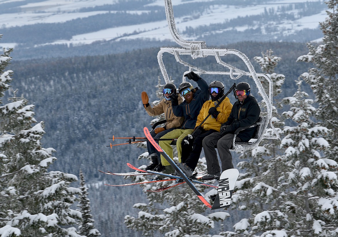 Skiers and snowboarders ride Chair 1 to the summit on Whitefish Mountain Resort's opening day Thursday. (Julie Engler/Whitefish Pilot)