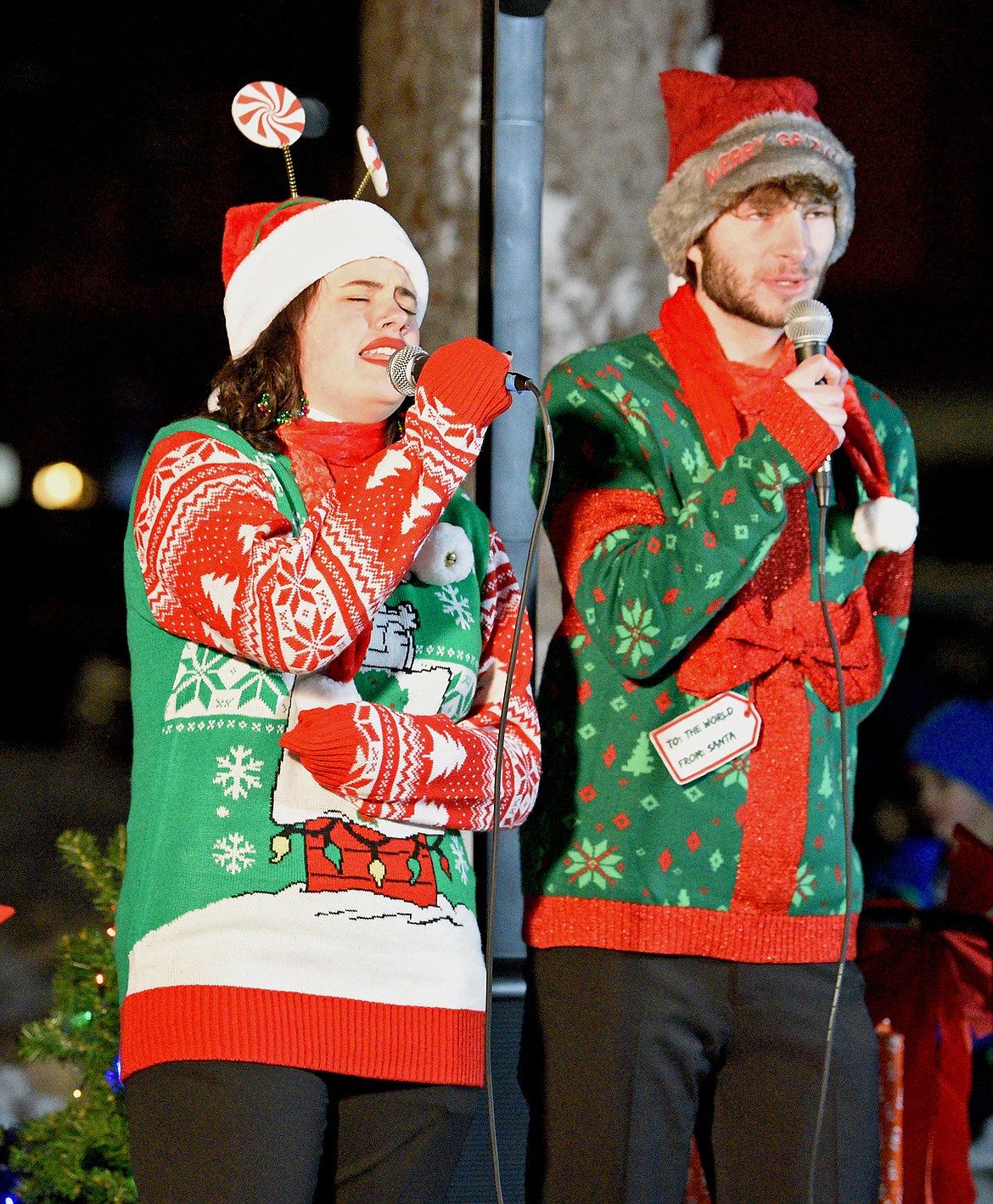 Singers with the FVCC Vocal Ensemble perform at Depot Park during the Whitefish Christmas Stroll on Friday. (Whitney England/Whitefish Pilot)