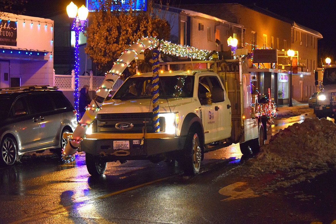 A Grant County Public Utility District service truck decked out in Christmas lights for the Bells on Basin parade in Ephrata on Saturday.