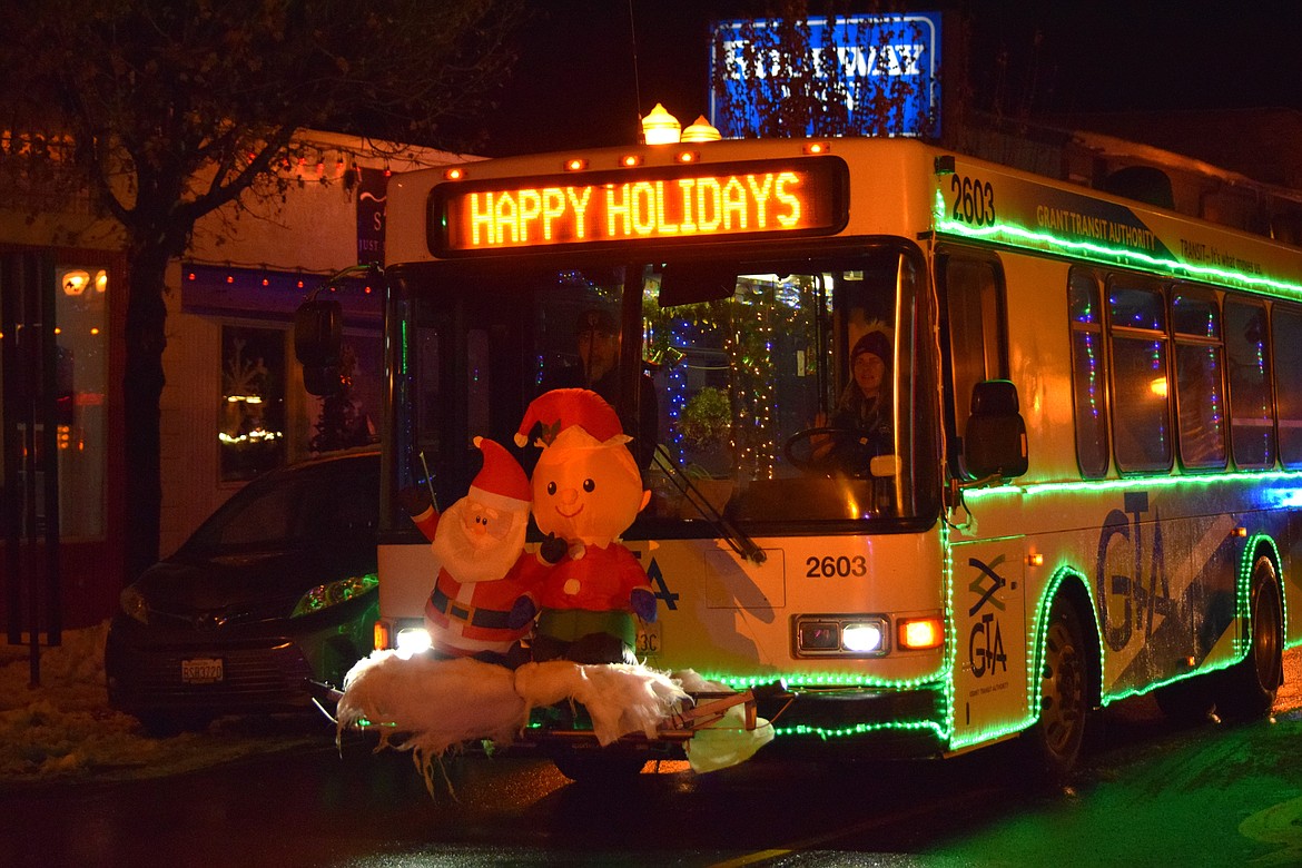 A Grant County Transit Authority bus decked out in holiday decorations for the Bells on Basin parade in Ephrata on Saturday.