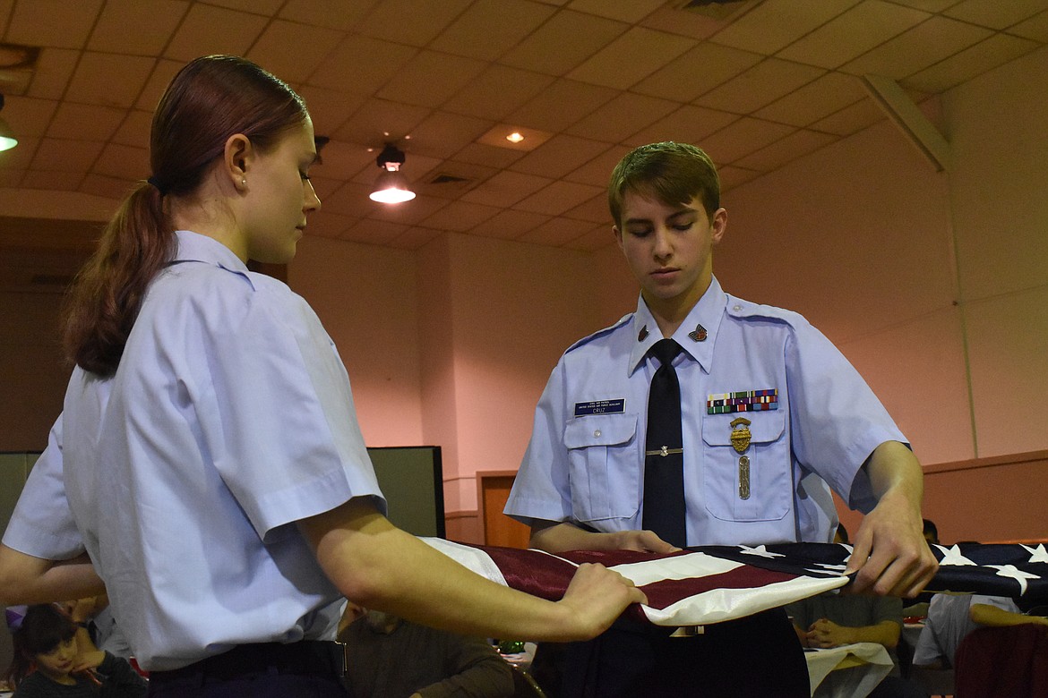 After dinner, cadets performed a flag folding ceremony where three folded an American flag while a fourth explained the meaning of each fold to the audience.