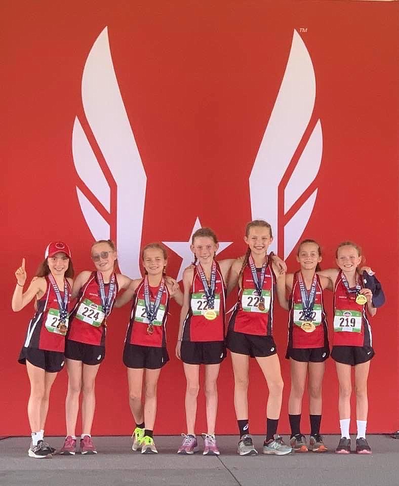 Courtesy photo
The North Idaho Distance Project girls age 9-10 team won a national championship at the USATF National Junior Olympic Cross Country Championships on Dec. 10 in College Station, Texas. From left are Vivian Howard, Kyla Hutchison, London Dance, Finley Taylor, Charlotte Carr, Summer Dance and Ashlyn Brazle.