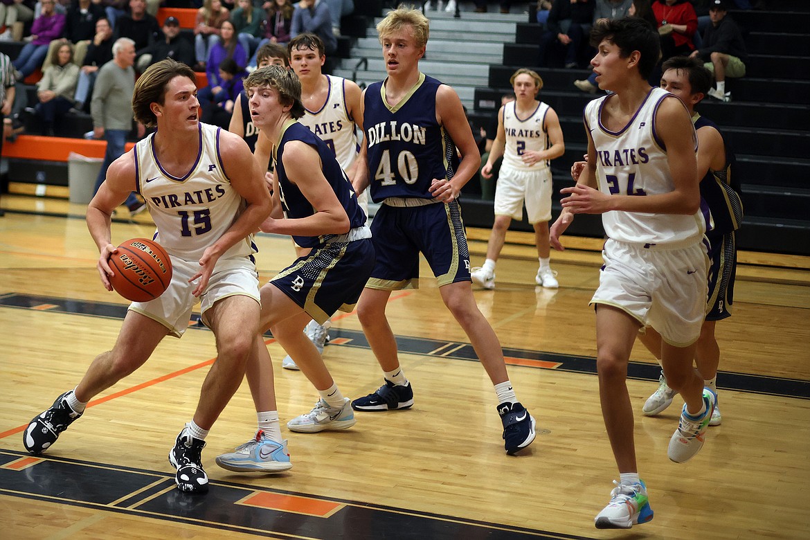 Polson senior Owen McElwee looks for a lane against Dillon at the Frenchtown Tip-Off Tournament Friday. (Jeremy Weber/Bigfork Eagle)