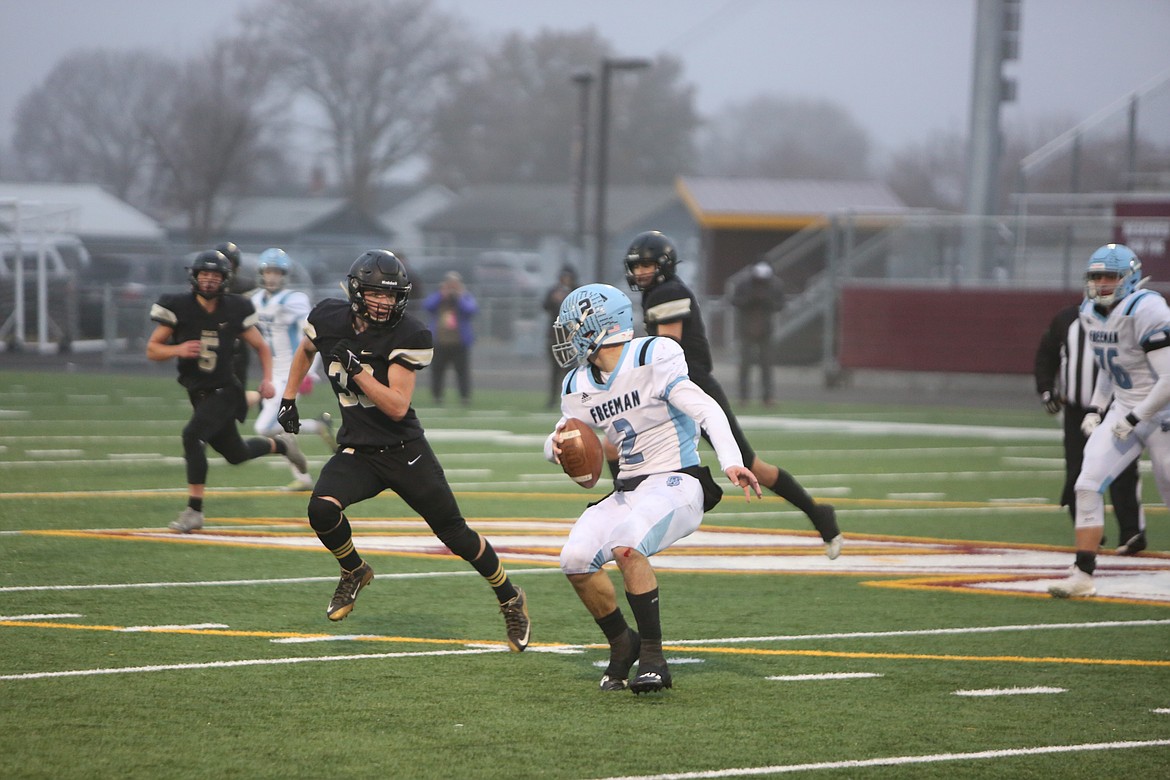 Royal junior linebacker Jared Lee (left) pressures Freeman quarterback Boen Phelps during the 1A state semifinals. Lee was one of eight Knights to make the second-team South Central Athletic Conference all-league list. As a team, the Knights had 22 selections to the all-league list.