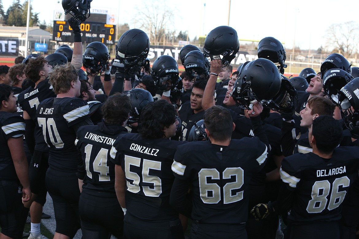 The Knights sing their fight song after winning the 1A state championship.