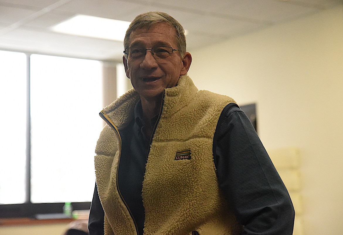 Lincoln County Commissioner Jerry Bennett enjoyed talking with friends and colleagues at a retirement party in his honor on Wednesday, Dec. 14, at the county courthouse. (Scott Shindledecker/The Western News)