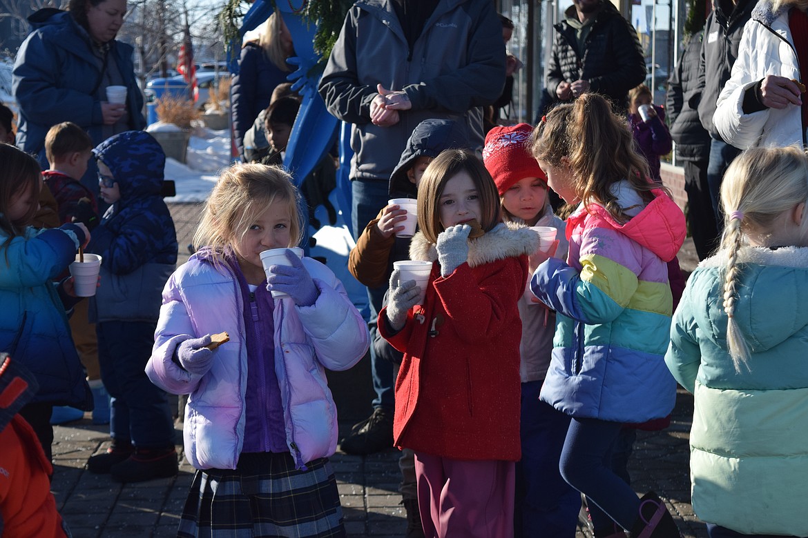 Kindergartners from the Moses Lake Christian Academy enjoy cookies and hot chocolate after singing Christmas carols at the Red Door Cafe on Wednesday.