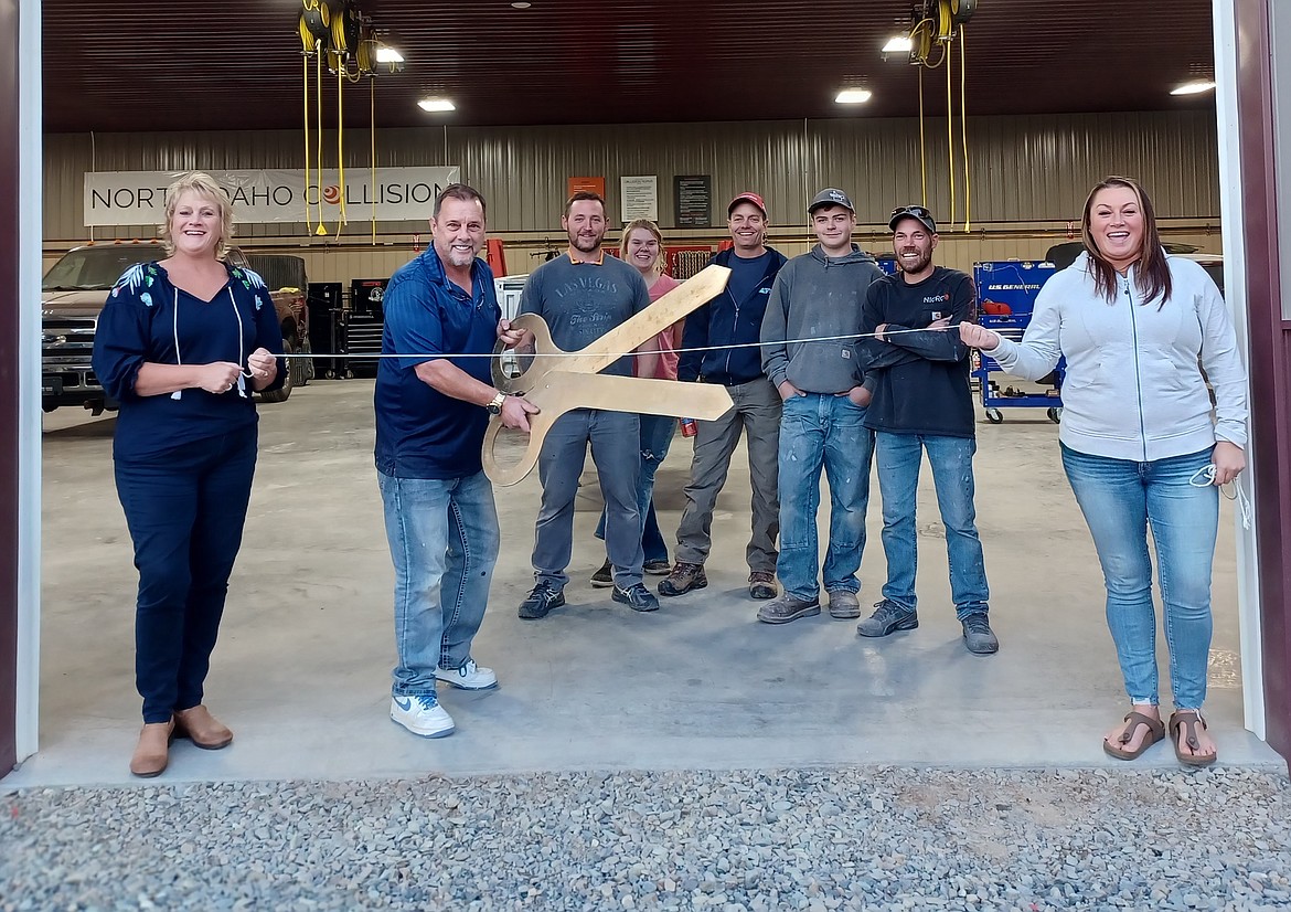 Shane Florea, second from left, is pictured with his crew and members of the Bonners Ferry Chamber of Commerce at a recent ribbon-cutting ceremony to celebrate the expansion of his business.