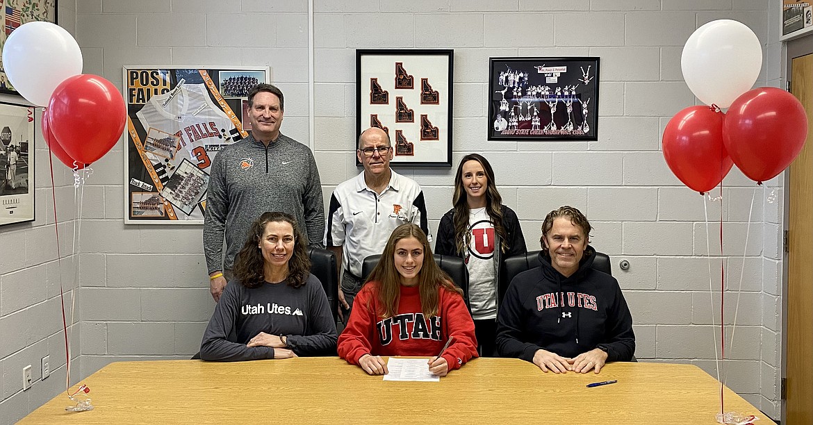 Courtesy photo
Post Falls High senior Anna Peters recently signed a letter of intent to run cross country and track at the University of Utah. Seated from left are Andrea Peters, Anna Peters and Anthony Peters; and standing from left, Craig Christensen, Post Falls High athletic director; Brian Trefry, Post Falls High head cross country coach; and Jessie Ward, Post Falls High assistant cross country coach.