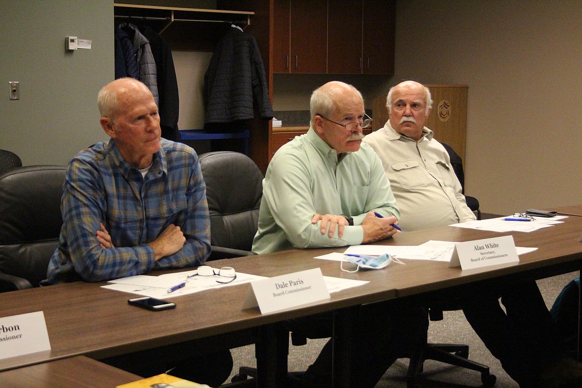 Samaritan Healthcare commissioners (from left) Dale Paris, Alan White and Tom Frick listen to a presentation on options for financing the new Samaritan Hospital Dec. 6.