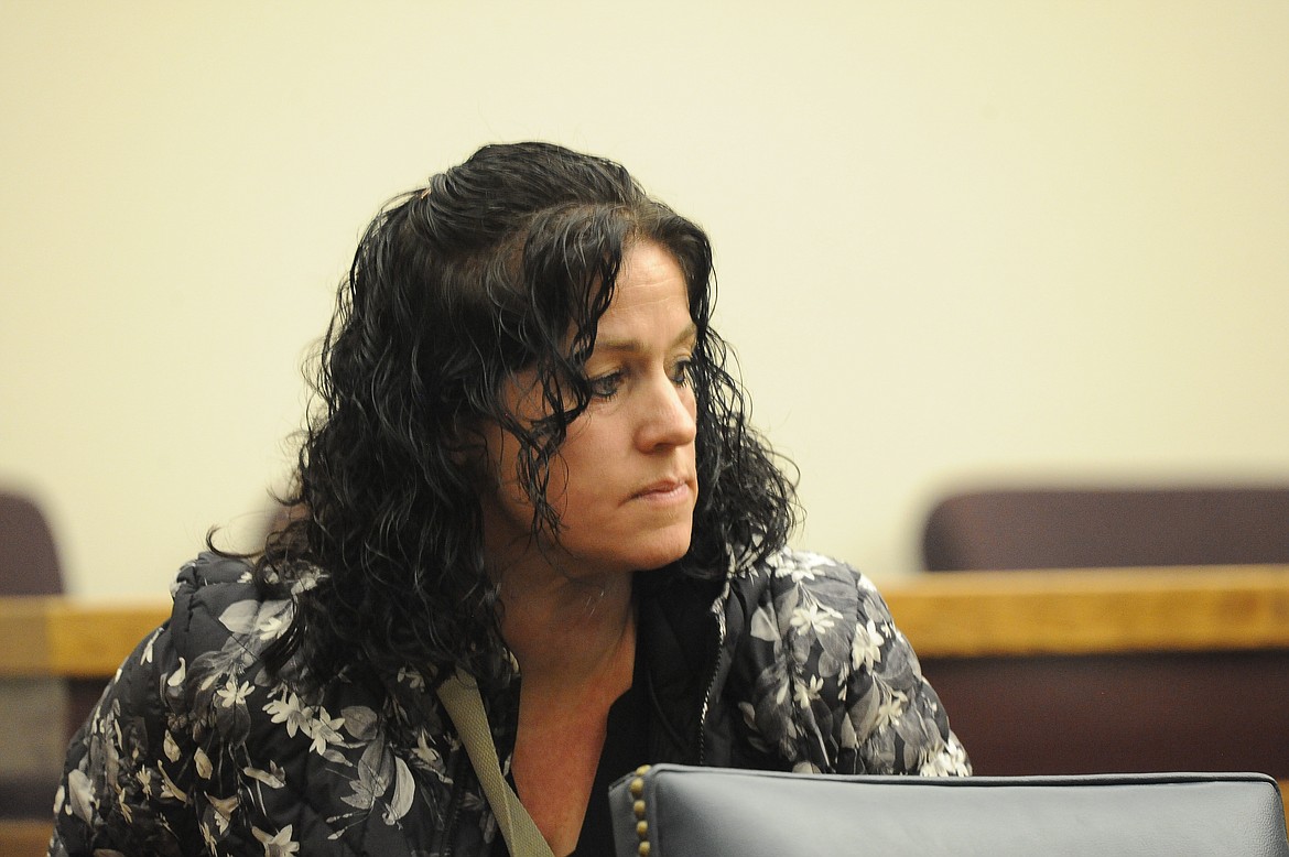 Amy Elizabeth Glanville stands after Flathead County District Judge Heidi Ulbricht continues her sentencing on Thursday, Dec. 15. (Derrick Perkins/Daily Inter Lake)