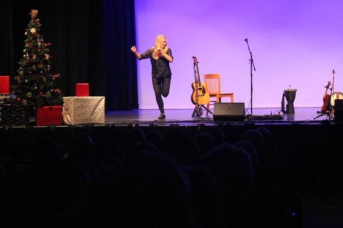 Greta Gothard kicks up her heels, trying to stay ahead of her sister Willow at Irish step dancing. The performance was part of a concert sponsored by the Central Basin Community Concert Association.