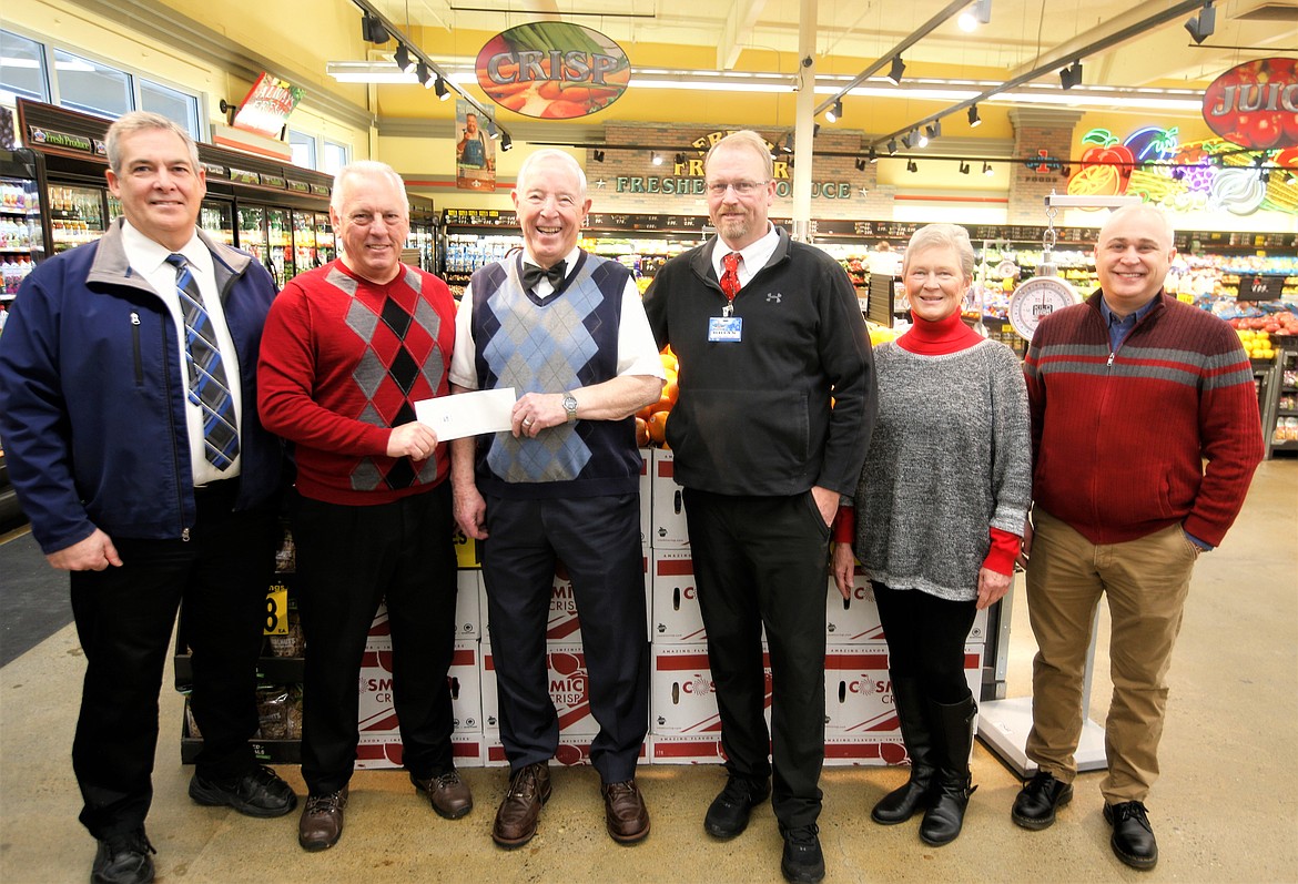 Super 1 Foods donates $7,500 to The Press Christmas for All program Thursday at the Super 1 Foods Hayden store. From left, Randy McIntire, Super 1 Foods vice president; Eric Haakenson, Hagadone Corp. communication division controller; Ron McIntire, Super 1 Foods owner; Brian Howell, Super 1 Foods store director; Elaine Kingston, board chair of Charity Reimagined; and Clint Schroeder, Hagadone Media Group president.