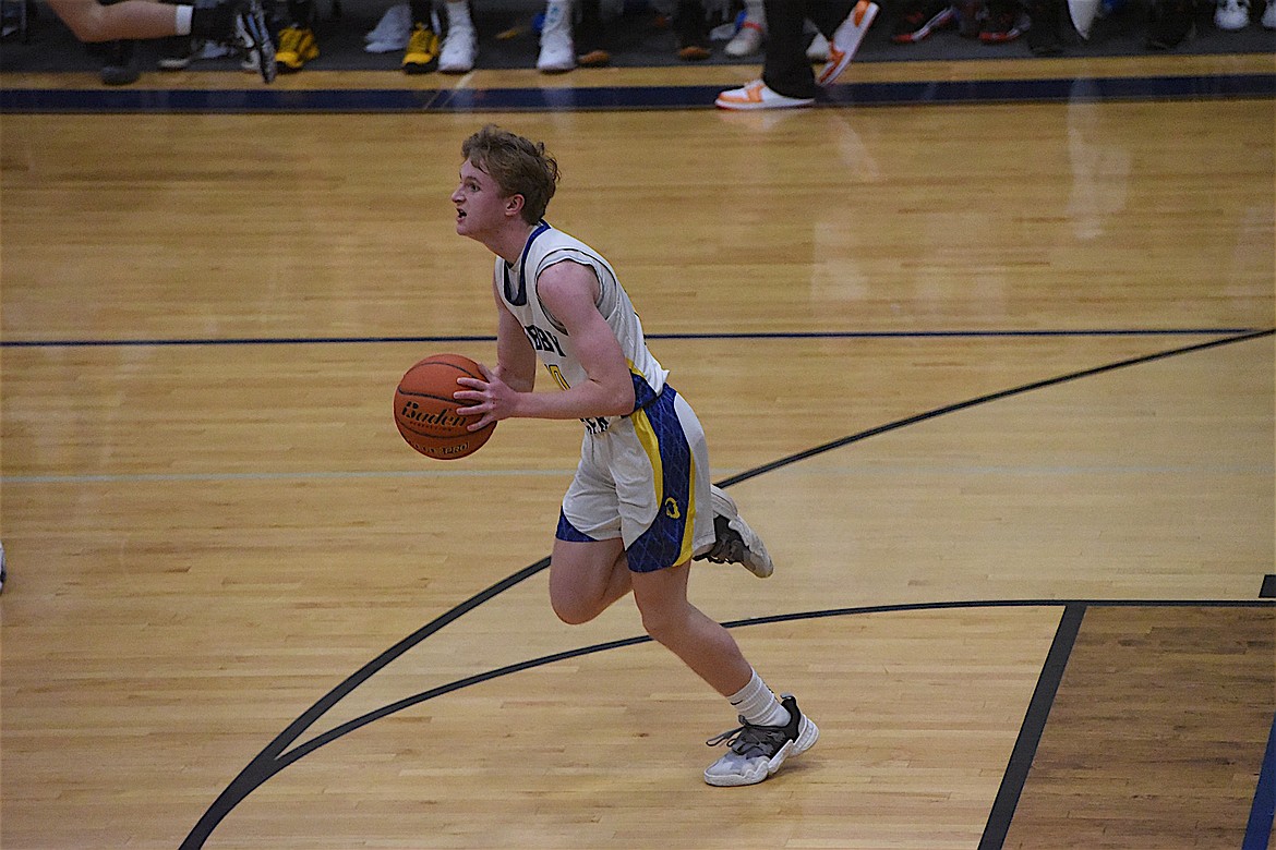 Libby's Ryan Beagle pushes the ball upcourt during the Logger's game against Ronan on Thursday, Dec. 15. (Scott Shindledecker/The Western News)