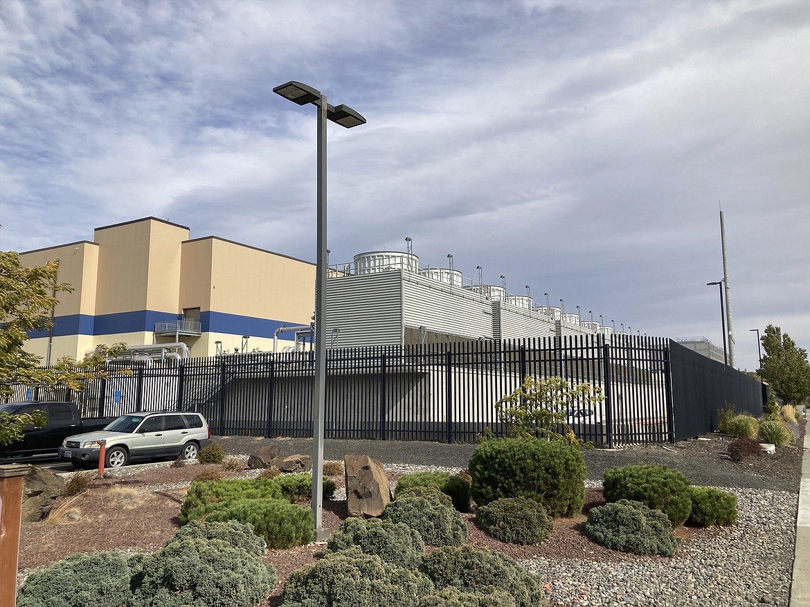 The exterior of a Google data center is pictured in The Dalles, Ore., on Oct. 5, 2021. Residents of The Dalles should soon know how much of their water Google's data centers there have been using to cool the computers, after a lawsuit seeking to keep the information confidential was dropped. Data centers around the world help people stream movies, store trillions of photos and conduct daily business online, but a single facility can churn through millions of gallons of water per day. (AP Photo/Andrew Selsky, File)