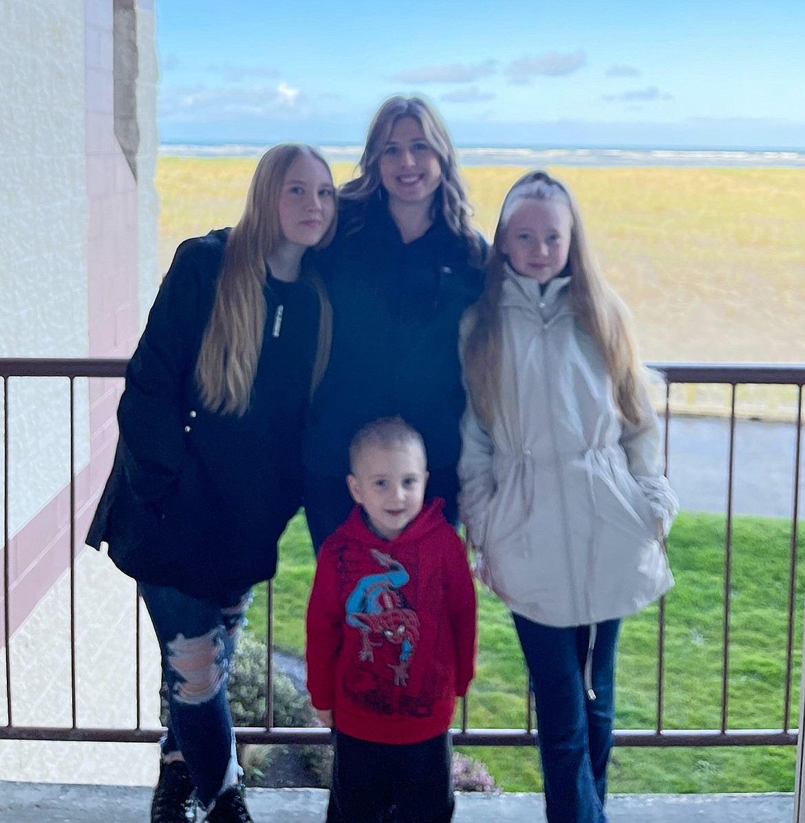 Kristy Gibbs is seen here with her children, Kamarae, 14, left, Kaylee, 12 and Caden, 4. Gibbs, a Post Falls resident and Post Falls High grad, was diagnosed with breast cancer in October, the month before her brother, sister-in-law, sister-in-law's mom and unborn nephew were killed in a car wreck.