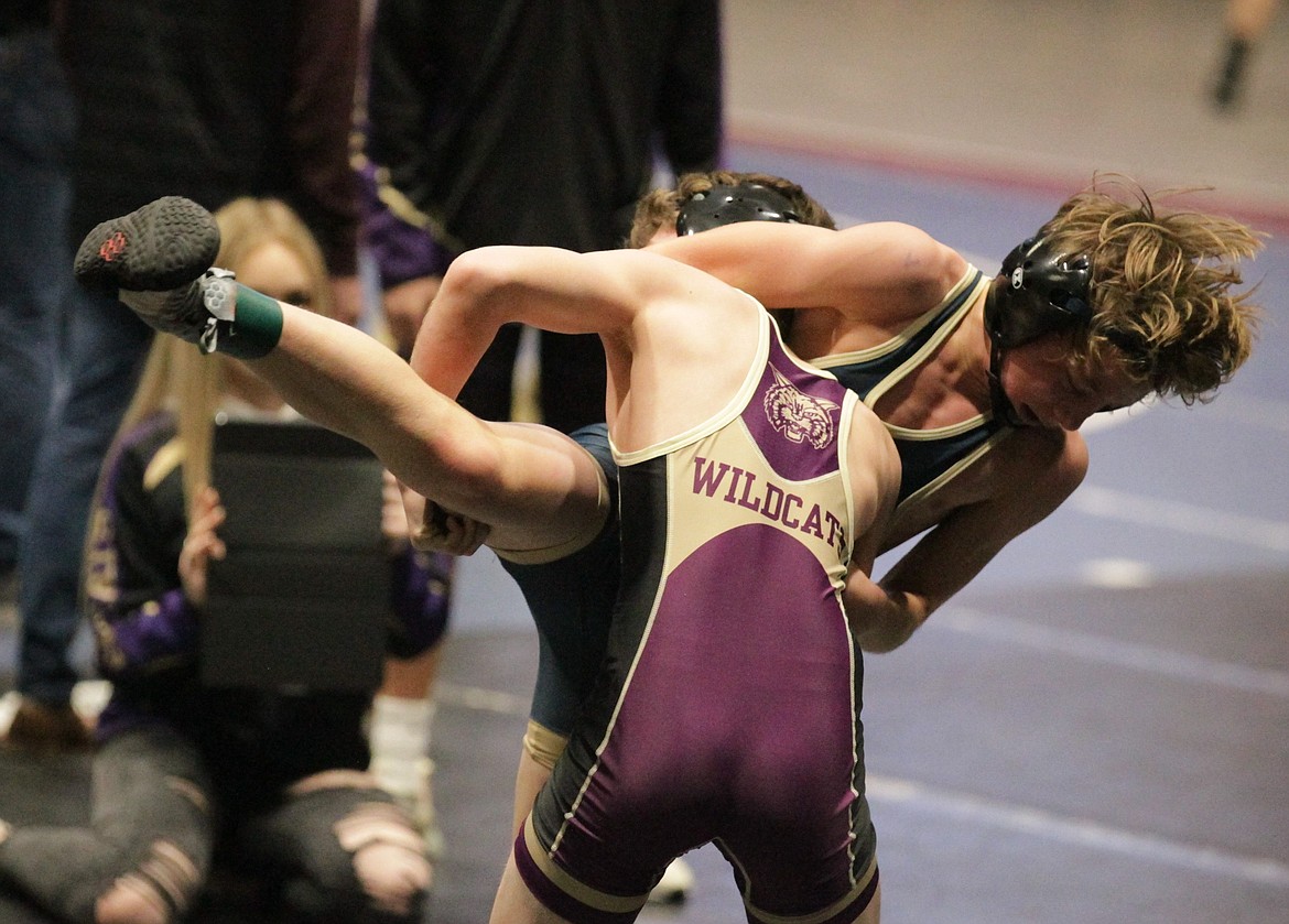 JASON ELLIOTT/Press
Kellogg freshman Aiden Figueroa takes down Timberlake freshman Sawyer Huston during a consolation round match in the Tri-State Invitational at North Idaho College on Friday. Figueroa won by a 12-0 major decision.