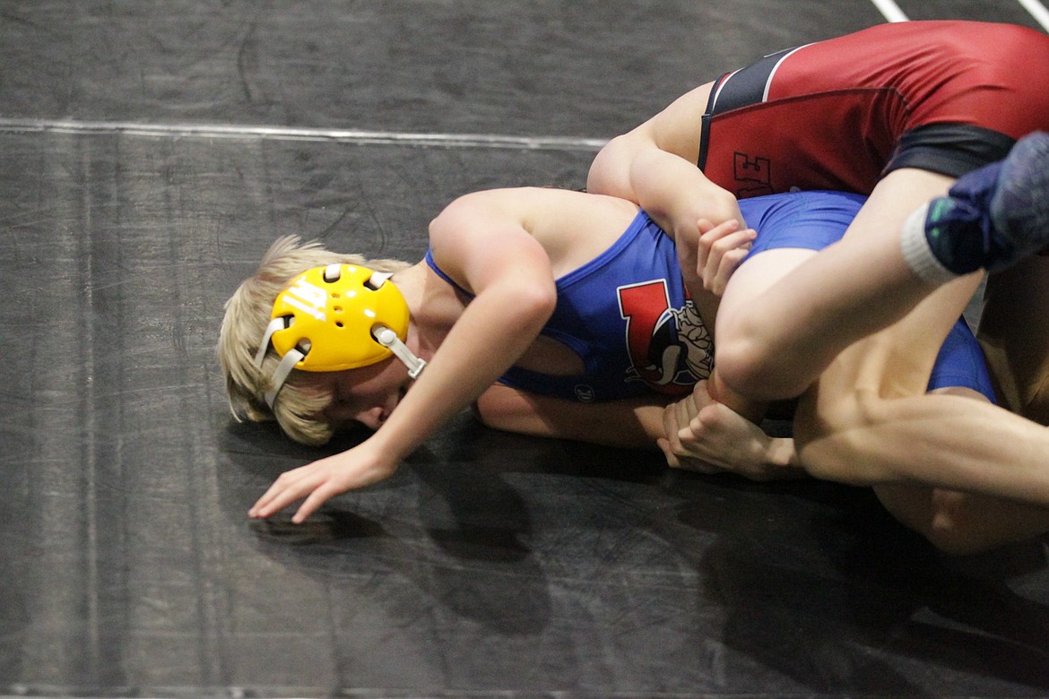 JASON ELLIOTT/Press
Coeur d'Alene freshman Rocco White attempts to get out of the grasp of Mt. Spokane junior Tanner Crosby during a quarterfinal match at 98 pounds in the Tri-State Invitational on Friday at North Idaho College. Crosby, seeded second in the tournament, won by pin in 2:58.