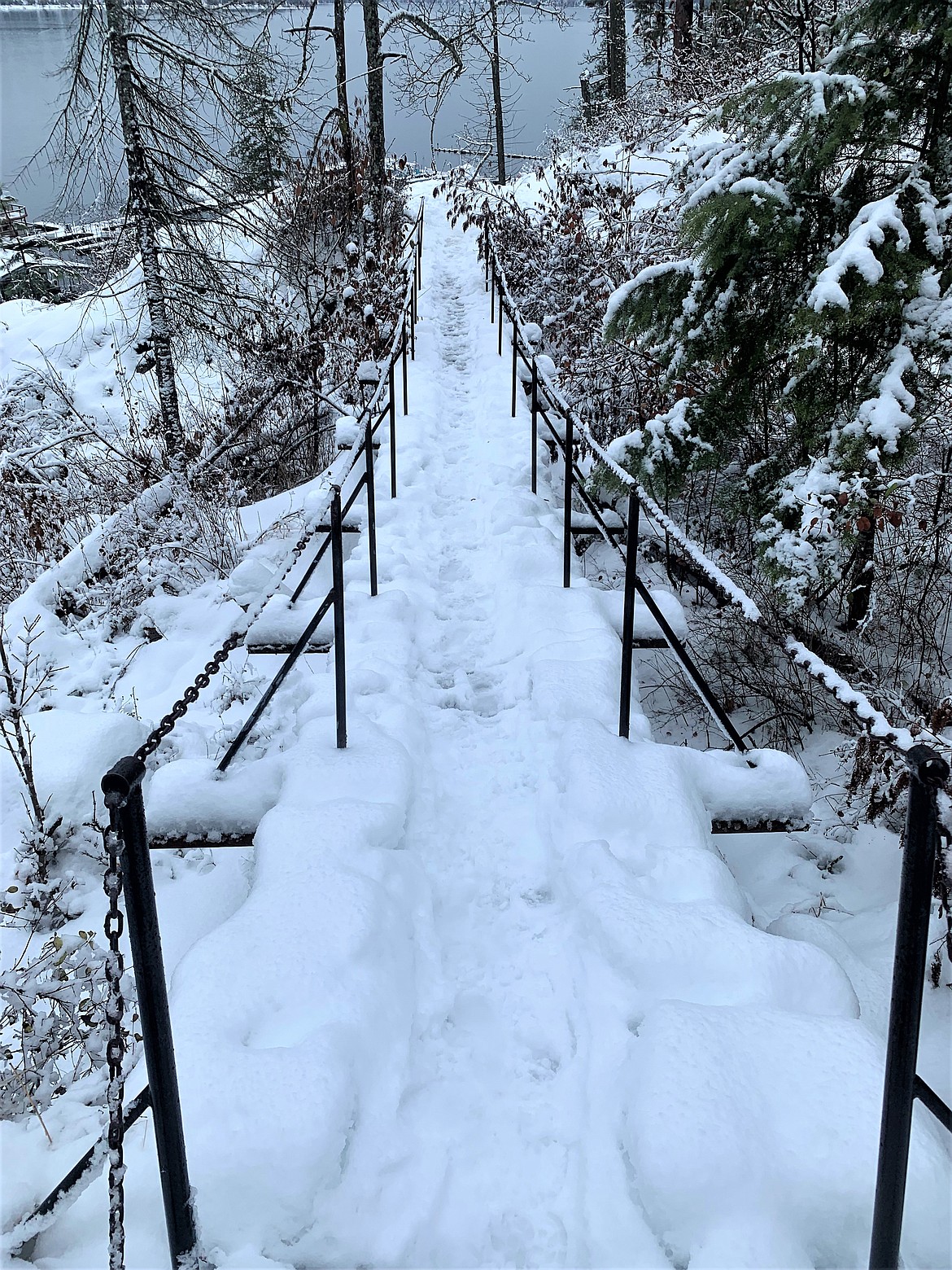 Snow covers a foot bridge on Tubbs Hill.