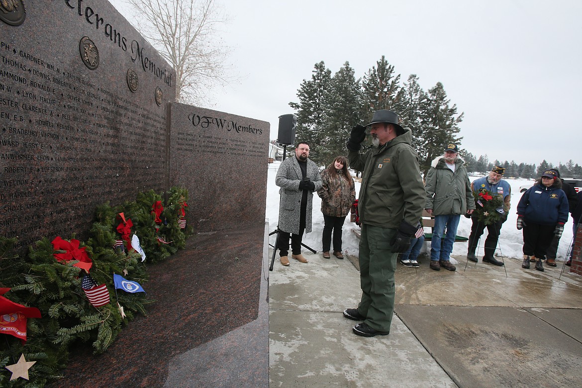 Gunnie Krueger salutes a remembrance wreath in memory of those who served and are serving in the U.S. Space Force during a 2022 Wreaths Across America ceremony in Rathdrum.