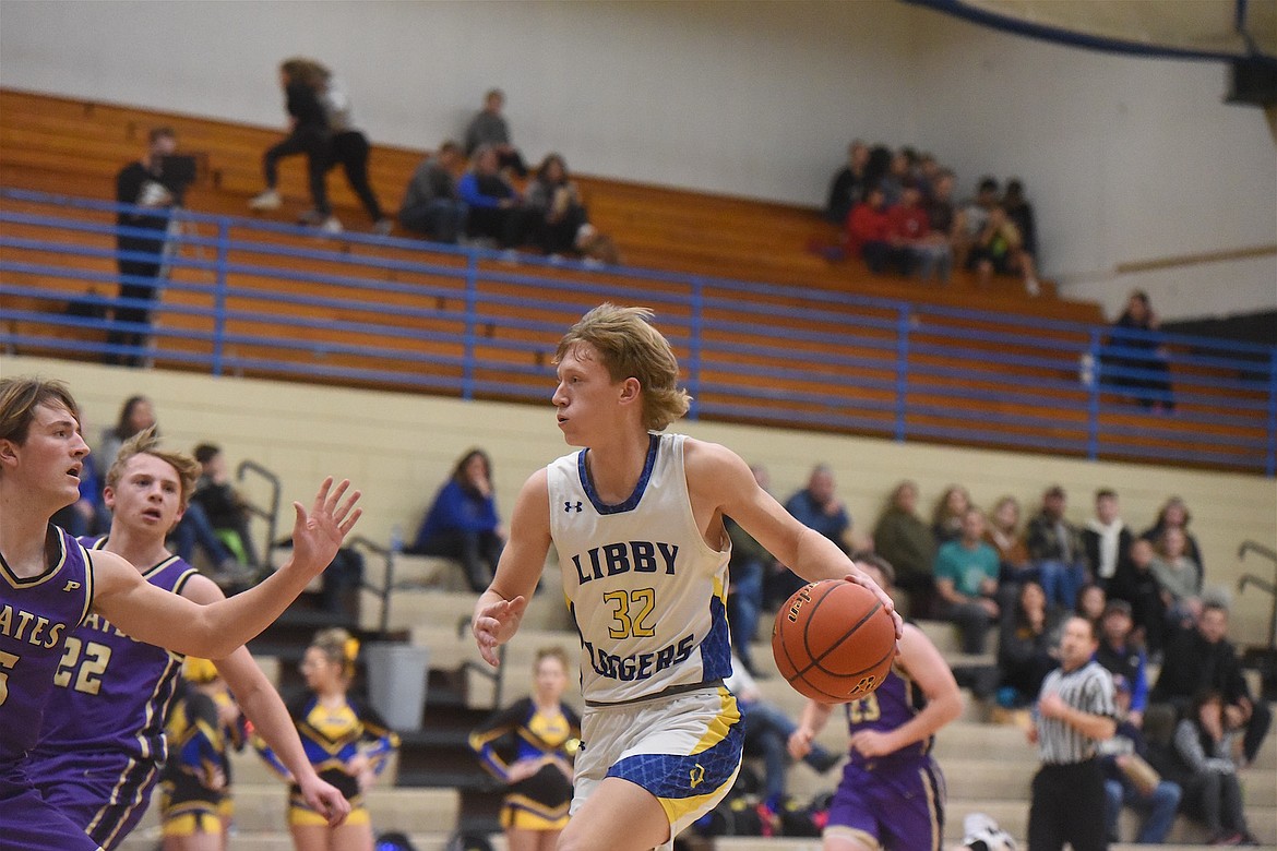 Libby's Cy Williams heads to the basket in last Saturday's game against Polson. (Scott Shindledecker/The Western News)