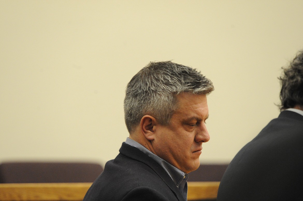 Aaron Dean Archer sits beside his defense attorney in Flathead County District Court during his Dec. 15 sentencing on a felony criminal endangerment charge. (Derrick Perkins/Daily Inter Lake)