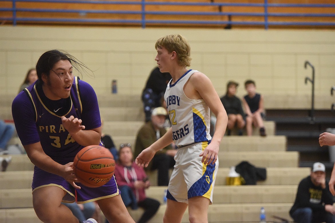 Polson's Cymian Kauley (34) saves a ball from going out of bounds in last Saturday's game at Libby. (Scott Shindledecker/The Western News)