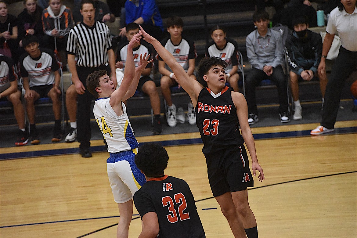 Ronan's Elijah Tonasket defends against Libby's Tyler Andersen during a game on Thursday, Dec. 15. (Scott Shindledecker/The Western News)