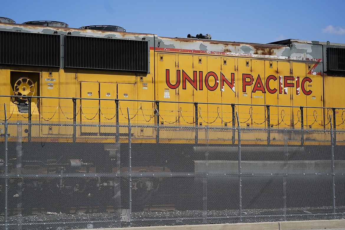 FILE - A Union Pacific train engine sits in a rail yard on Wednesday, Sept. 14, 2022, in Commerce, Calif. Federal regulators and shippers questioned Union Pacific’s decision to temporarily limit shipments from certain businesses more than 1,000 times this year as part of its effort to clear up congestion across the railroad. The head of the U.S. Surface Transportation Board Martin Oberman said Wednesday, Dec. 14, he’s concerned about UP’s increasing use of these embargoes because they disrupt operations of the businesses that rely on the railroad, and they haven’t seemed to help UP’s performance significantly either. (AP Photo/Ashley Landis, File)