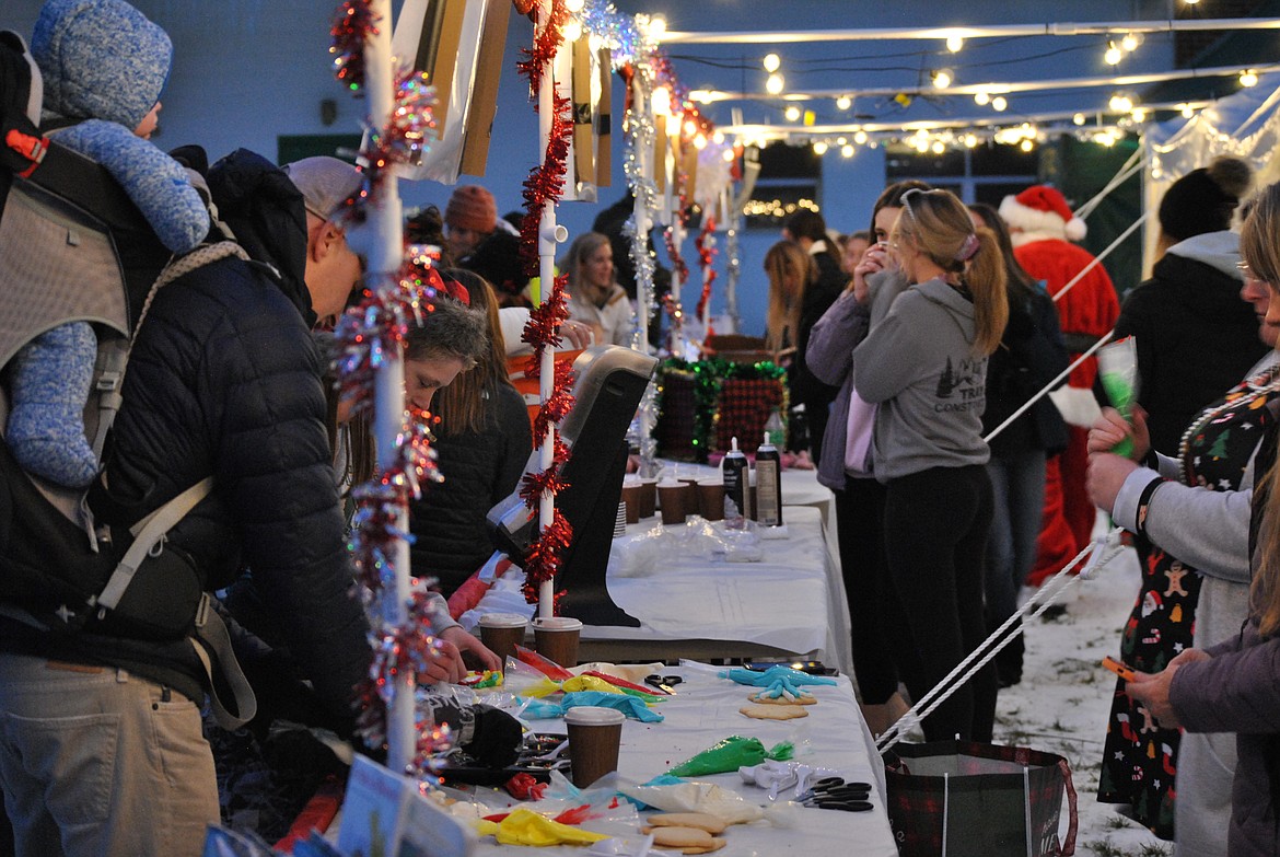 Families from around the county gathered together Dec. 13, for a fun-filled Winter Festival at St. Regis School. The district joined with the Mineral County Family Connections Collaborative to provide an evening of festive outdoor holiday entertainment for parents and children alike. Attendees could decorate Christmas cookies, have a light dinner from the snack bar, drink hot cocoa, play bingo, write a letter to Santa, and take a picture with the man in the jolly red suit. Horse-drawn sleigh rides were provided by Hidden Horse Outpost from the Black Diamond Guest Ranch in DeBorgia, riders went dashing through the snow around the football field - "laughing all the way." (Mineral Independent/Amy Quinlivan)