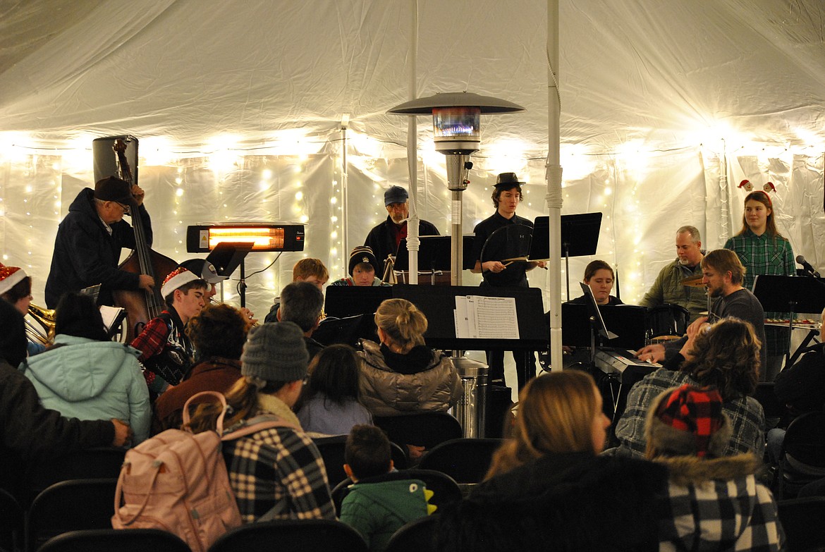 The St. Regis Winter Festival capped off the evening with a one of kind outdoor holiday concert under the schools new big top tent. Decked out in Christmas lights and warmed up with heaters the audience stayed nice and cozy as they listened to cheery tunes played by students and community members. The band was led by Superintendent/Music Teacher Derek Larson. (Mineral Independent/Amy Quinlivan)