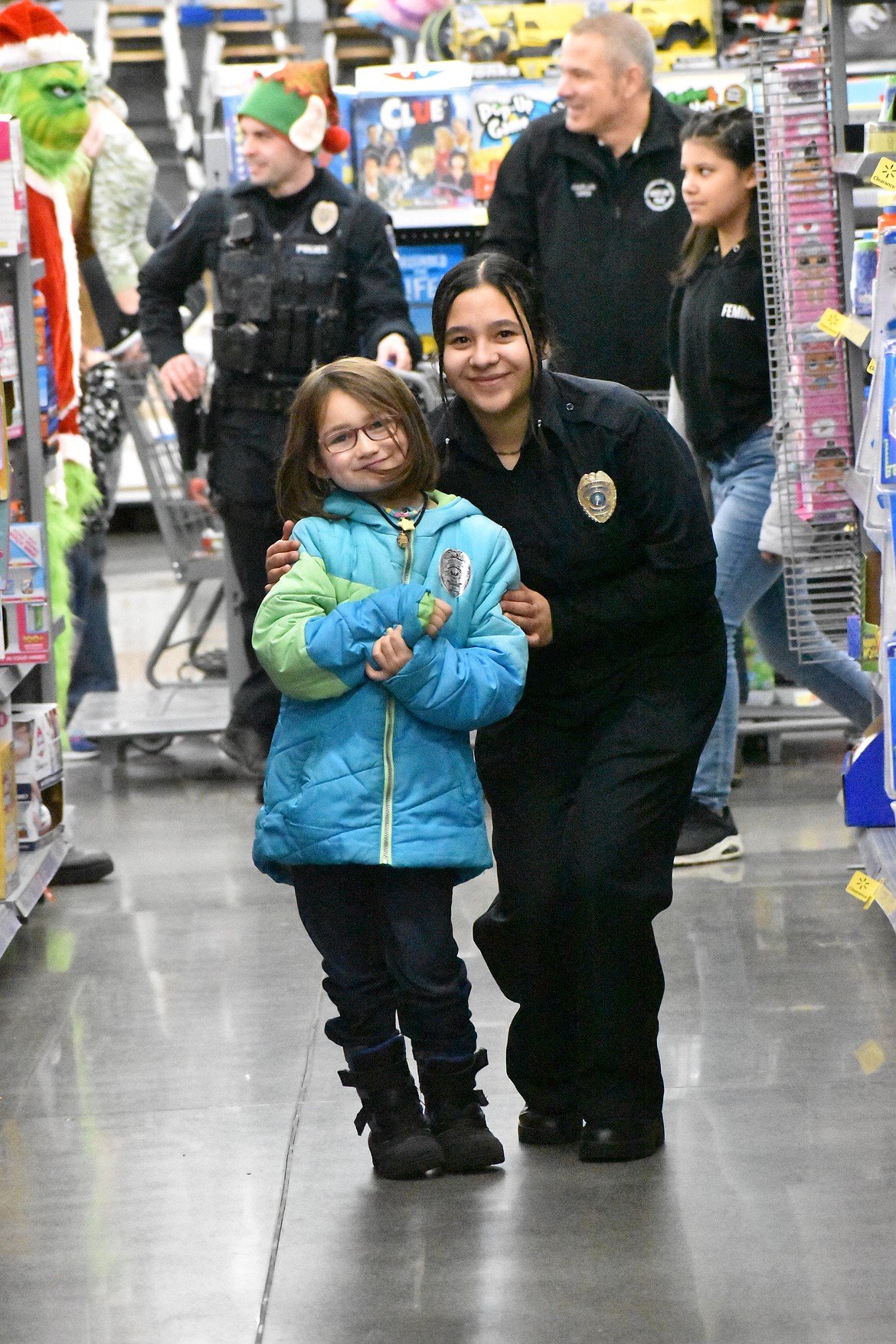 Law enforcement personnel were paired with a child to shop for themselves and the rest of their family for Christmas gifts at the Shop with a Cop event last week.