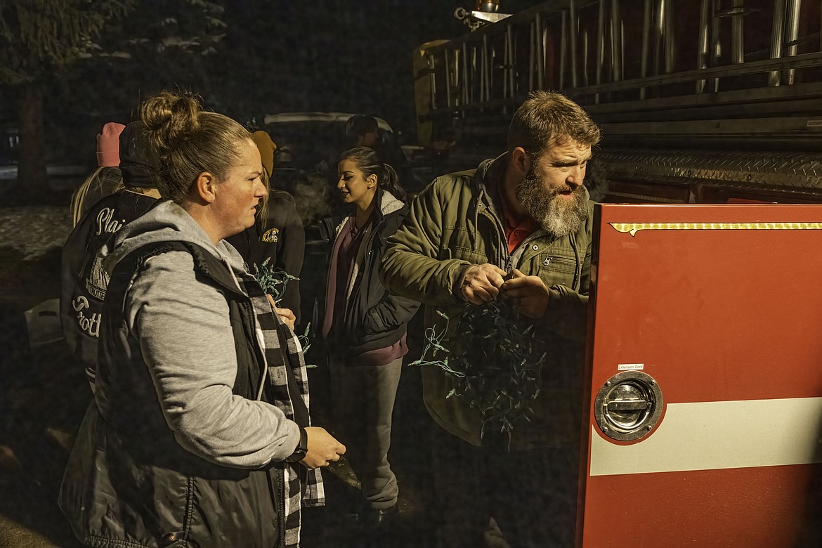 Organizer of Operation Candy Cane Kati Mitchell with Fire Chief Anthony Young. (Tracy Scott/Valley Press)