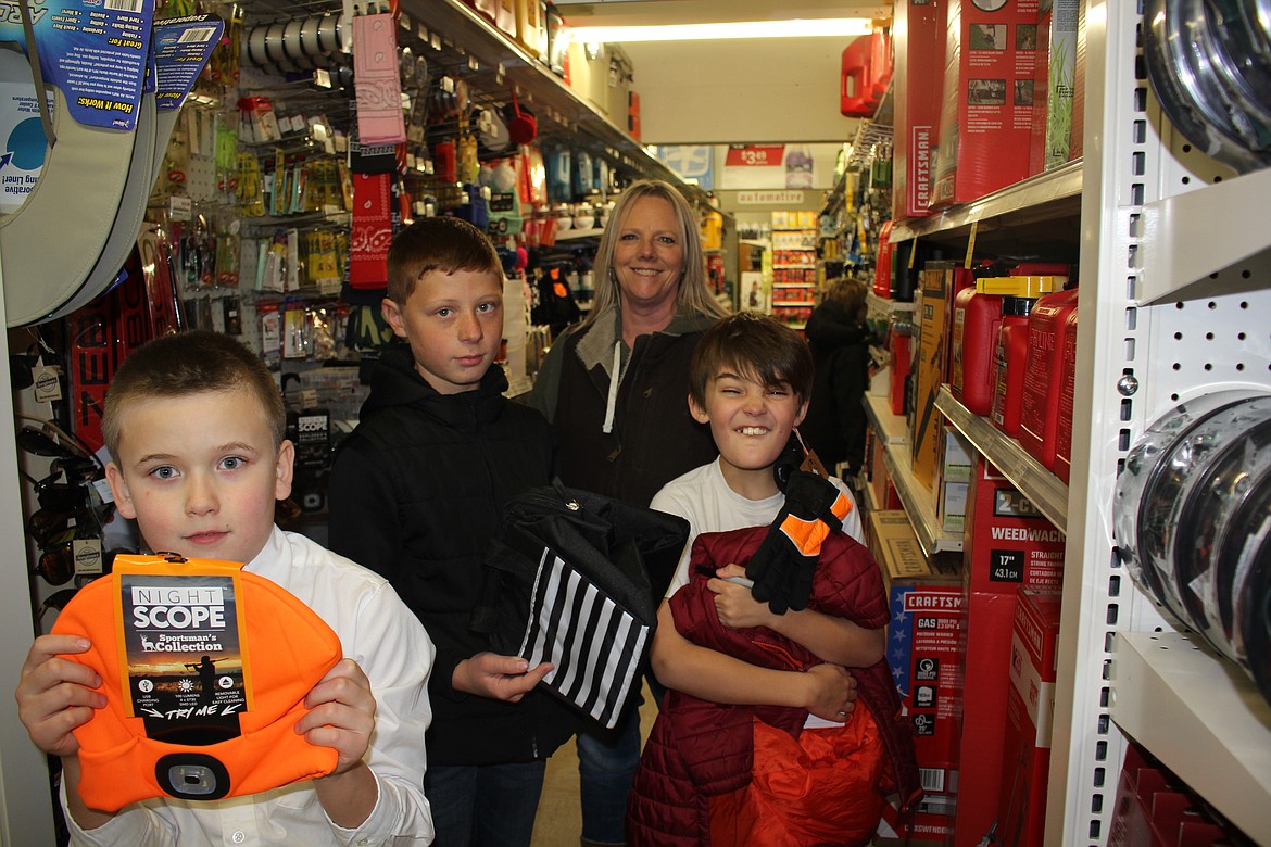 Students with Kelann McLees, from left, Murdoc Ovitt, Charlie Quick and Mason Rogers at ACE Hardware.