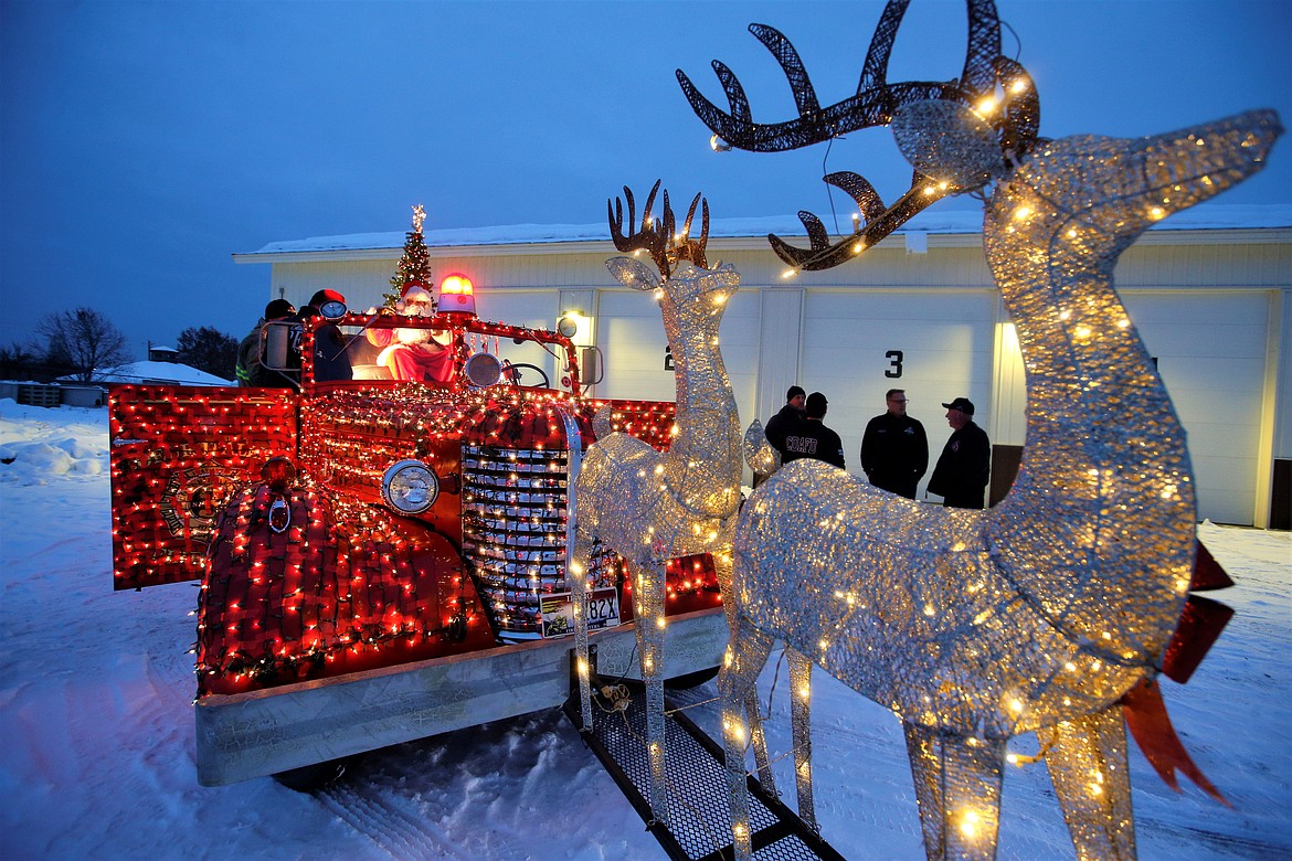 The Mobile Santa Food Drive gets ready for takeoff from the Coeur d'Alene fire station at Kathleen Avenue and Ramsey Road on Monday.