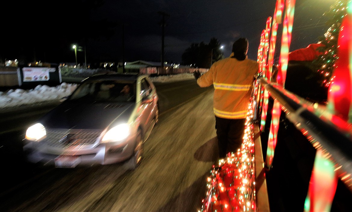 A vehicle passed the Mobile Santa Food Drive on Monday.