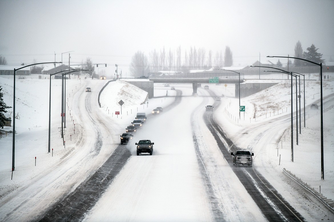 Traffic travels along the Kalispell Bypass as snow falls on Tuesday, Dec. 20. (Casey Kreider/Daily Inter Lake)