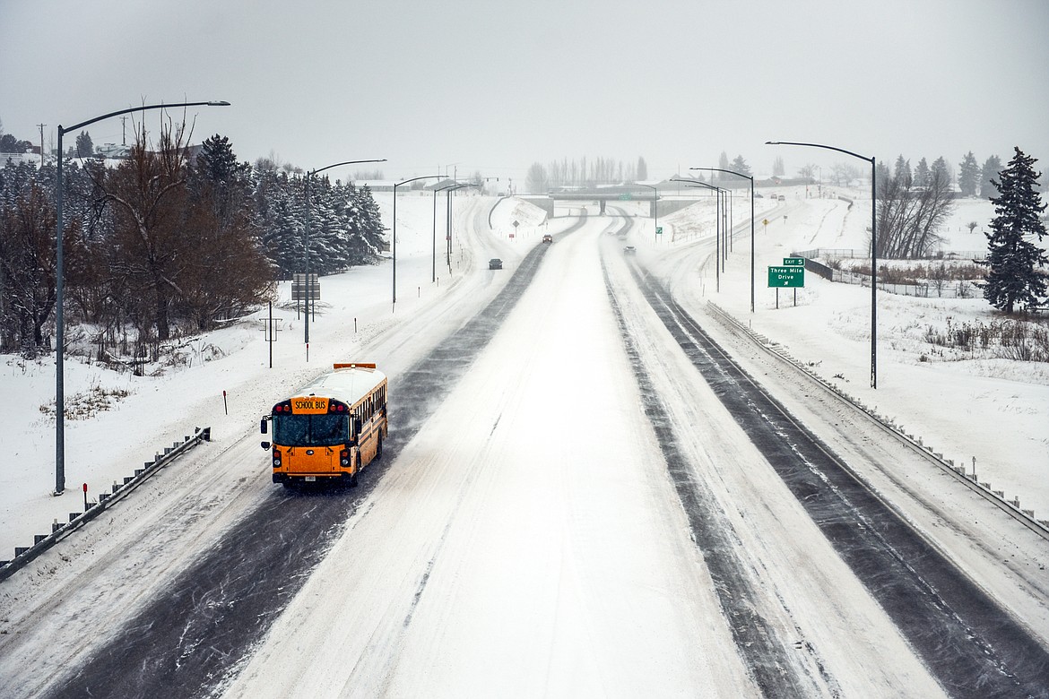 Traffic travels along the Kalispell Bypass as snow falls on Tuesday, Dec. 20. (Casey Kreider/Daily Inter Lake)