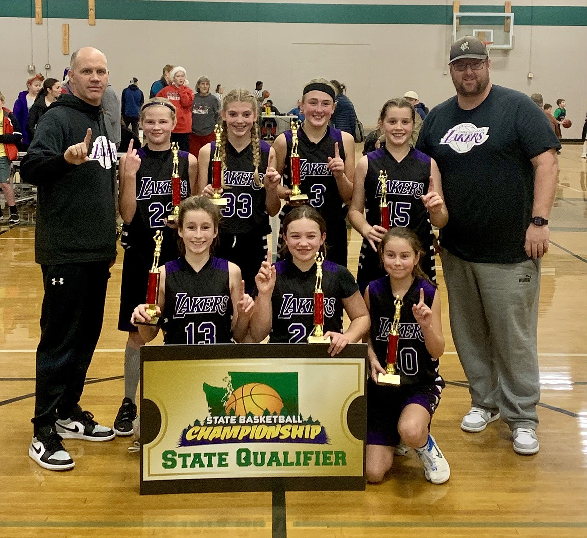 Courtesy photo
The Coeur d'Alene Lakers sixth grade AAU girls basketball team went 4-0, beating the Northwest Blazers 47-46 in the championship game to win the 2022 Santa Slammer AAU tournament at The Warehouse in Spokane. In the front row from left are Noelia Axton, Emmerson Cummings and Jaycee Bateman; and back row from left, coach Royce Johnston, Brynlee Johnston, Ainsley Carlson, Payton Brown, Savannah Stevens and coach Corey Brown. Not pictured is Greta Angle.