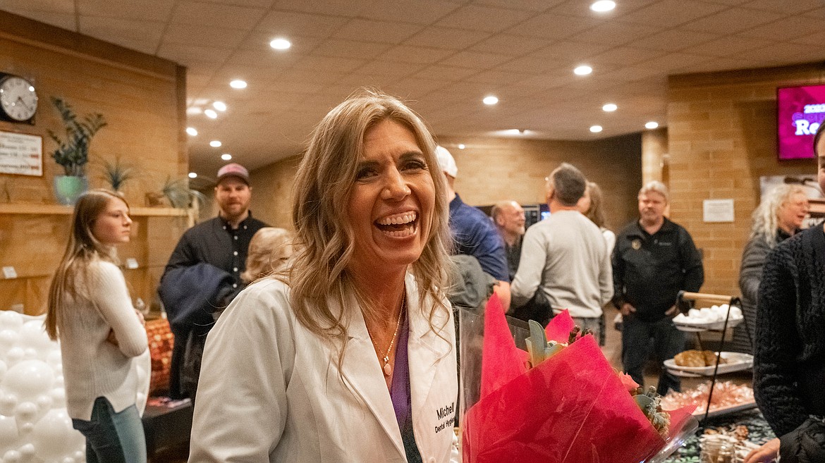 Michell Anderson, 40, of Coeur d’Alene, celebrates her graduation from NIC’s Dental Hygiene program in a reception after the ceremony Wednesday, Dec. 14 at Boswell Hall on NIC’s main campus in Coeur d’Alene.