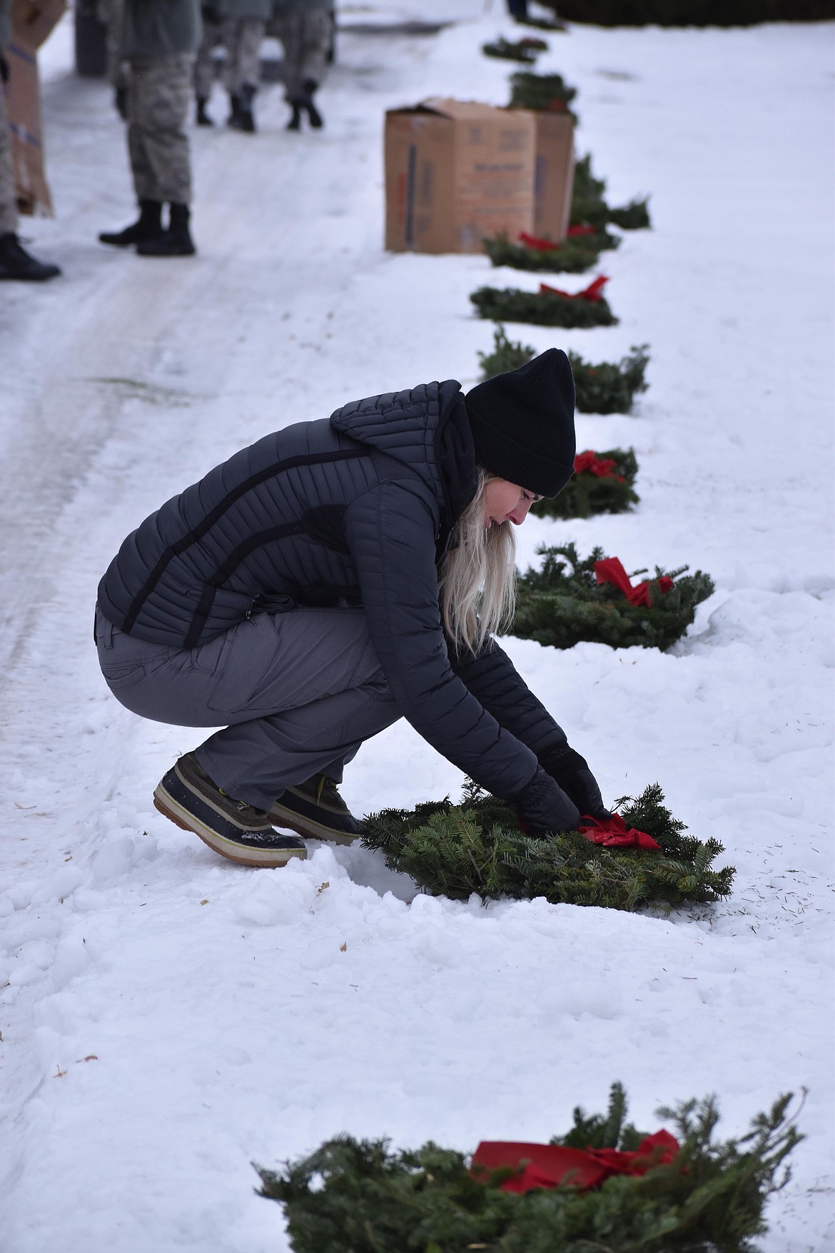 Many graves at the Ephrata Cemetery were covered in snow and ice so the Columbia Basin Composite Squadron of the Civil Air Patrol and volunteers laid wreaths along the path of the road through the cemetery.