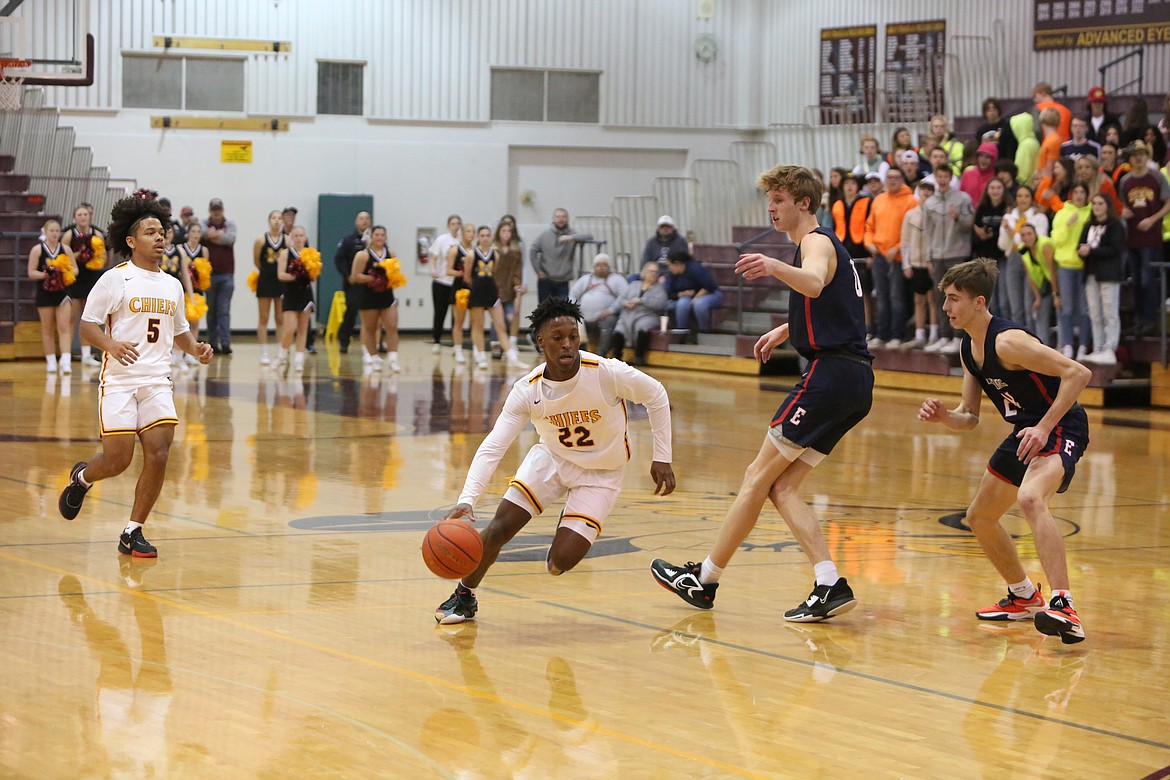 Moses Lake junior Joel Middleton (22) drives into the pain during the Maverick’s 58-56 win over Ellensburg.