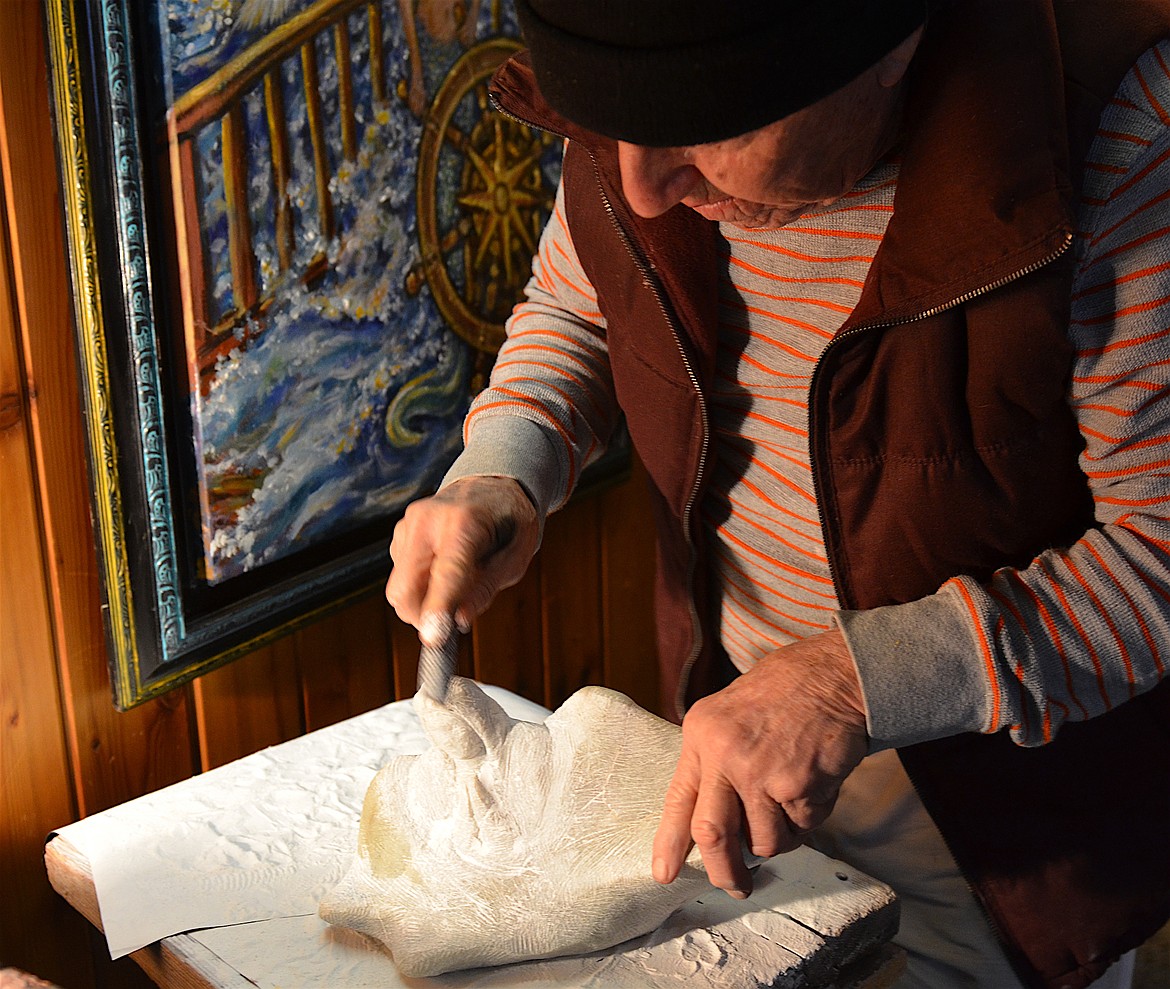 Will Richards works on a soapstone carving of an angel. (Kristi Niemeyer/Lake County Leader)