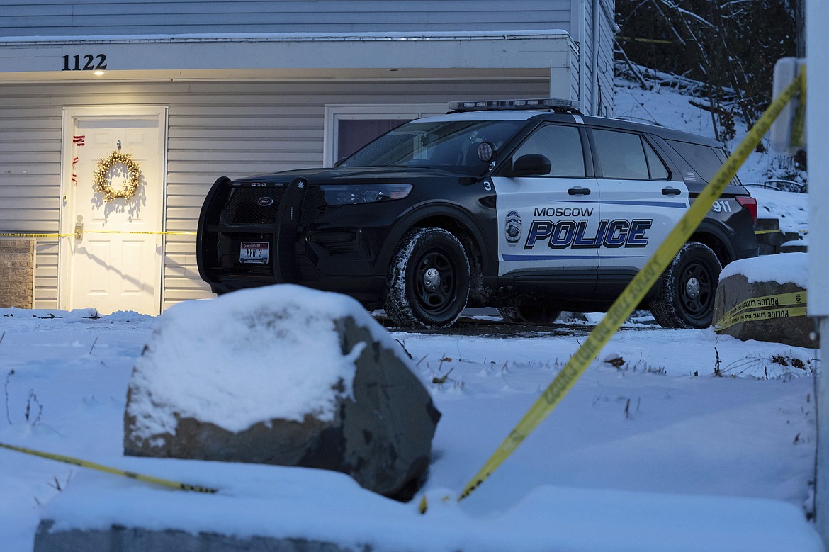 Bare spots are seen on Nov. 29, 2022, in the snowy parking lot in front of the home where four University of Idaho students were found dead on Nov. 13, in Moscow, Idaho, after vehicles belonging to the victims and others were towed away earlier in the day. Idaho Police investigating the stabbing deaths of the students say they're working with law enforcement in Eugene, Ore., to determine if a white sedan found on the side of the road there is related to the Idaho case. (AP Photo/Ted S. Warren, File)