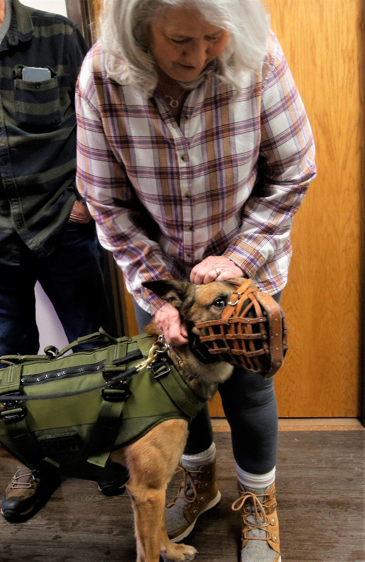 Diane Brewster pets Deuce at the Kootenai County Sheriff's Office on Wednesday.