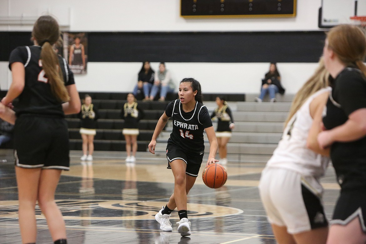 Ephrata junior Alessa Soto searches for a lane to the rim against the Royal defense.