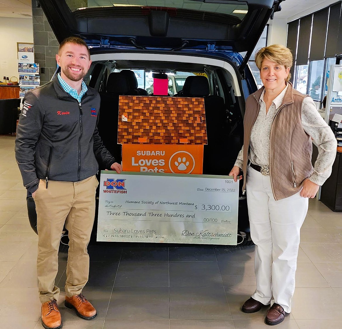 Don "K" Whitefish general manager Kevin Kaltschmidt presents a donation of  $3,300 to Stacie DaBolt, executive director of the Humane Society of Northwest Montana. The humane society was selected as the Hometown Charity for the 2022 Subaru Loves Pets campaign. (Photo courtesy of Don "K")