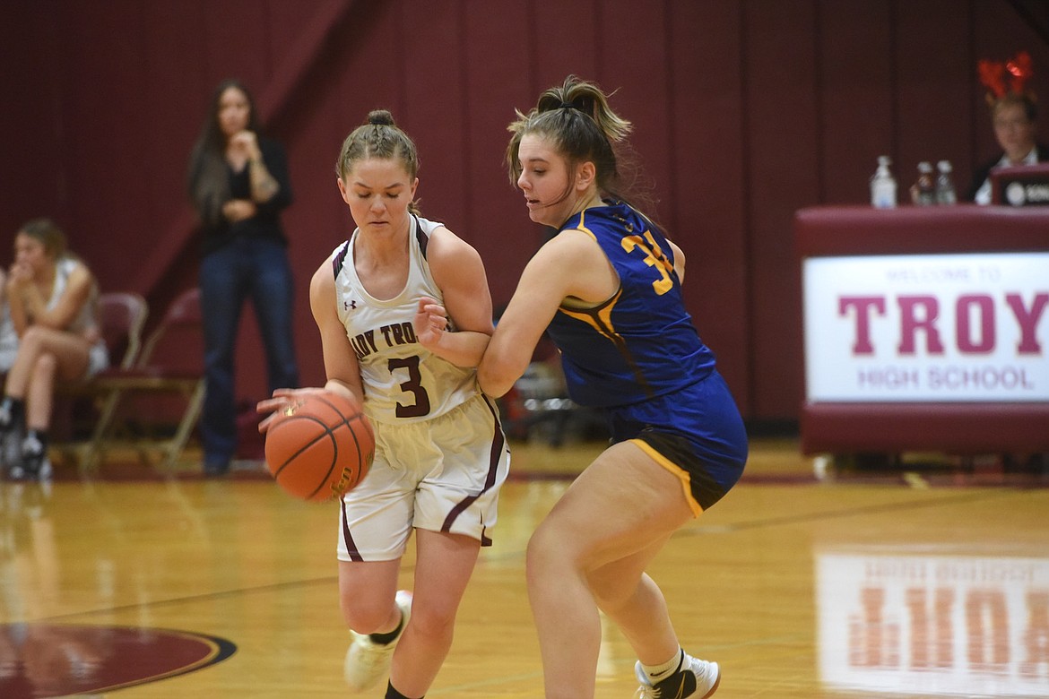 Troy's Isabelle Tunison battles against Libby's Addy Gilden-Vincent during Wednesday's game in Troy. (Scott Shindledecker/The Western News)